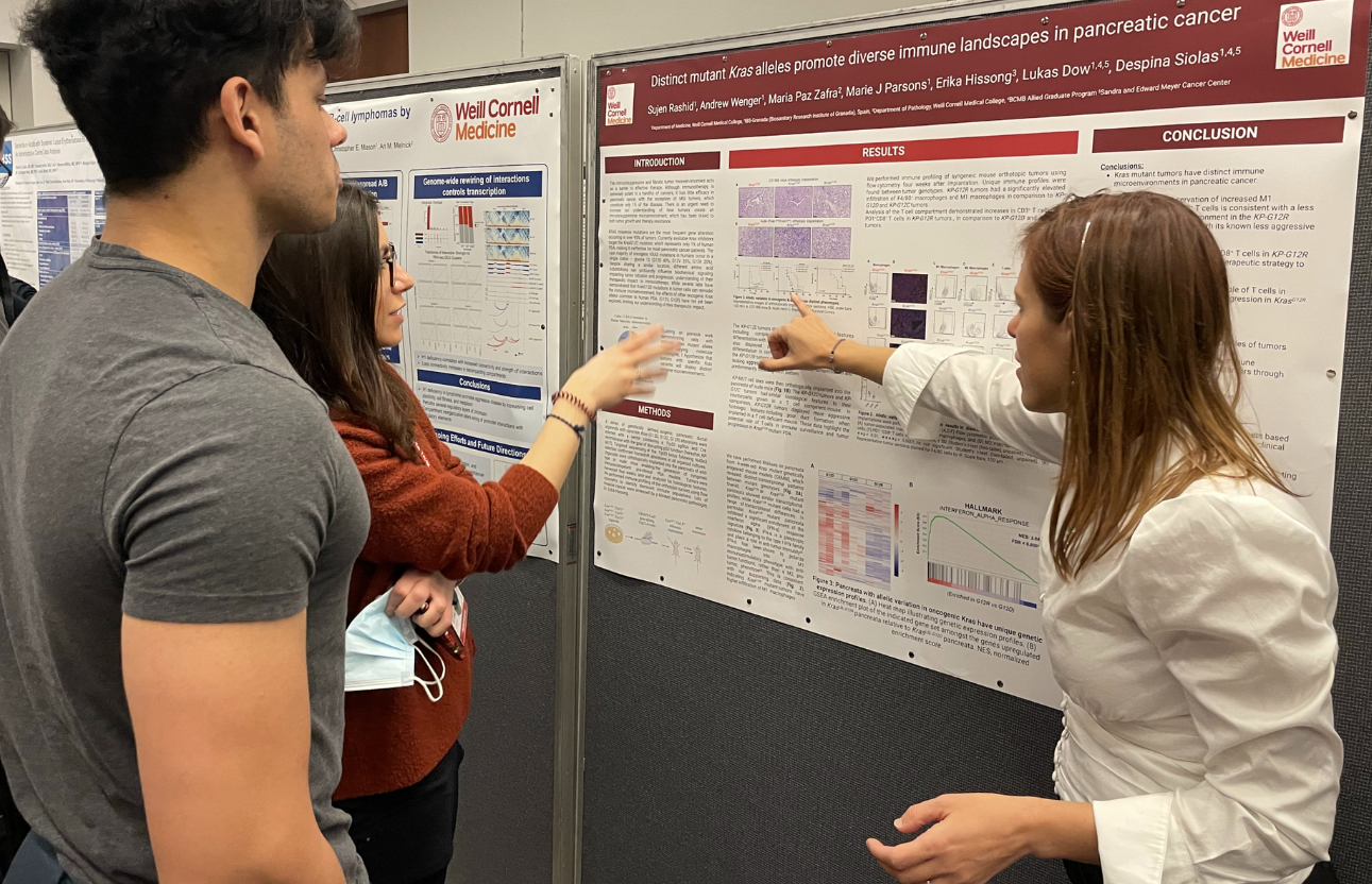 Dr. Despina Siolas can be seen here presenting lab data at the poster festival to fellow researchers.